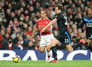 Arsenal v Manchester United 2009-10 Collection: Theo Walcott (Arsenal) Jonny Evans (Man United). Arsenal 1: 3 Manchester United