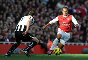 Arsenal v Newcastle United 2010-11 Collection: Theo Walcott (Arsenal) Jose Enrique (Newcastle). Arsenal 0: 1 Newcastle United