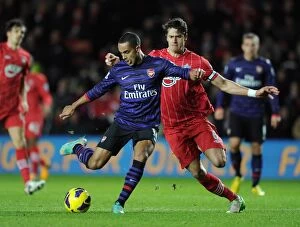 Southampton v Arsenal 2012-13 Collection: Theo Walcott (Arsenal) Jose Fonte (Southampton). Southampton 1: 1 Arsenal. Barclays Premier League