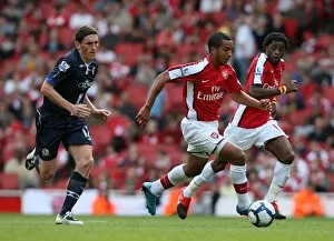 Images Dated 4th October 2009: Theo Walcott (Arsenal) Keith Andrews (Blackburn)