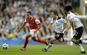 Images Dated 20th April 2011: Theo Walcott (Arsenal) Luka Modric (Tottenham). Tottenham Hotspur 3: 3 Arsenal