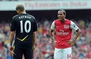 Images Dated 24th September 2011: Theo Walcott (Arsenal) Martin Petrov (Bolton). Arsenal 3: 0 Bolton Wanderers