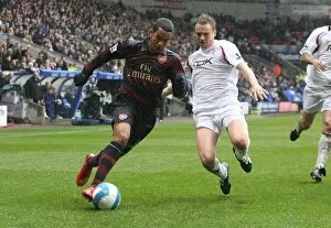 Images Dated 31st March 2008: Theo Walcott (Arsenal) Matt Taylor (Bolton)