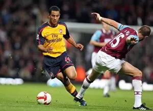 Images Dated 26th October 2008: Theo Walcott (Arsenal) Matthew Upson (West Ham)
