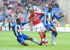 Wigan Athletic v Arsenal 2009-10 Gallery: Theo Walcott (Arsenal) Maynor Figueroa and Mohamed Diame (Wigan). Wigan Athletic 3