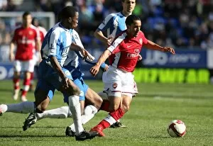 Images Dated 11th April 2009: Theo Walcott (Arsenal) Maynor Figueroa and Titus Bramble (Wigan)