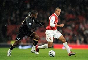 Images Dated 30th November 2010: Theo Walcott (Arsenal) Maynor Figueroa (Wigan). Arsenal 2: 0 Wigan Athletic