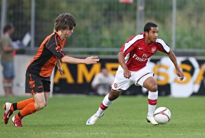 Burgenland XI v Arsenal Gallery: Theo Walcott (Arsenal) Michael Artner (Burgenland)