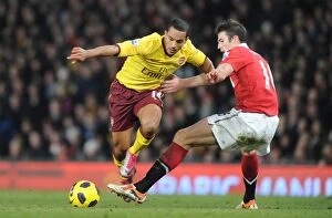 Images Dated 13th December 2010: Theo Walcott (Arsenal) Michael Carrick (Man United). Manchester United 1: 0 Arsenal