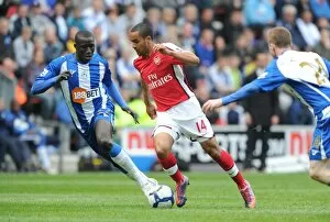 Images Dated 18th April 2010: Theo Walcott (Arsenal) Mohamed Diame (Wigan). Wigan Athletic 3: 2 Arsenal