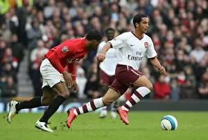 Images Dated 14th April 2008: Theo Walcott (Arsenal) Patrice Evra (Manchester United)
