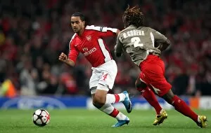 Arsenal v Standard Liege 2009-10 Collection: Theo Walcott (Arsenal) Reginal Goreux (Liege)