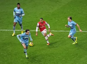 Images Dated 23rd January 2013: Theo Walcott (Arsenal) Ricardo Vaz te, Mark Noble and Joey O Brien (West Ham). Arsenal 5