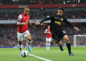 Images Dated 14th May 2013: Theo Walcott (Arsenal) Roger Espinoza (Newcastle). Arsenal 4: 1 Wigan Athletic. Barclays