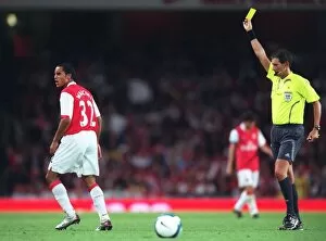 Theo Walcott (Arsenal) is shown the Yellow card by the referee
