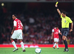 Theo Walcott (Arsenal) is shown the Yellow card by the referee Theo Walcott (Arsenal) is shown the Yellow card by the referee