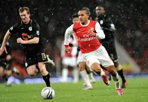 Arsenal v Wigan Athletic - Carlin Cup 2010-11 Collection: Theo Walcott (Arsenal) Steven Caldwell (Wigan). Arsenal 2: 0 Wigan Athletic