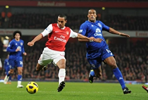 Arsenal v Everton 2010-11 Gallery: Theo Walcott (Arsenal) Sylvian Distin (Everton). Arsenal 2: 1 Everton, Barclays Premier League