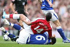 Theo Walcott (Arsenal) is tackled by Liam Ridgewell (Birmingham)
