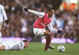 Tottenham v Arsenal Carling Cup Collection: Theo Walcott (Arsenal) Teemu Tainio (Spurs)