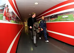 Arsenal V Bayern Munich 2012-13 Prints: Theo Walcott (Arsenal) walks in with former Arsenal Player Jens Lehmann