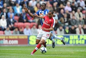 Wigan Athletic v Arsenal 2009-10 Gallery: Theo Walcott breaks past Wigan defender Maynor Figueroa to score the 1st Arsenal goal