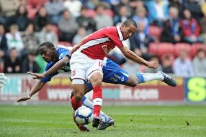 Wigan Athletic v Arsenal 2009-10 Gallery: Theo Walcott breaks past Wigan defender Maynor Figueroa to score the 1st Arsenal goal