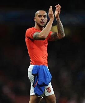 Images Dated 25th February 2015: Theo Walcott Celebrates with Arsenal Fans after UEFA Champions League Victory over AS Monaco