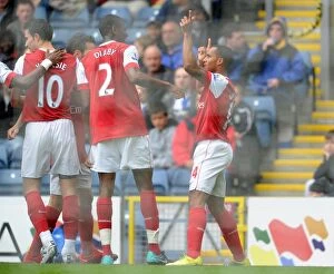 Images Dated 28th August 2010: Theo Walcott celebrates scoring the 1st Arsenal goal with Abou Diaby, Cesc Fabregas