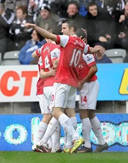 Images Dated 5th February 2011: Theo Walcott celebrates scoring the 1st Arsenal goal with Cesc Fabregas