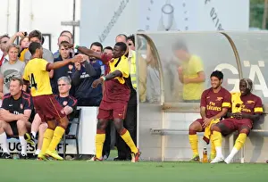 SC Neusiedl V Arsenal Prints: Theo Walcott celebrates scoring the 1st Arsenal goal with Emmanuel Eboue