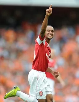Images Dated 21st August 2010: Theo Walcott celebrates scoring the 5th Arsenal goal. Arsenal 6: 0 Blackpool