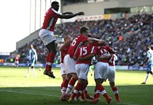 Images Dated 11th April 2009: Theo Walcott celebrates scoring Arsenals 1st goal