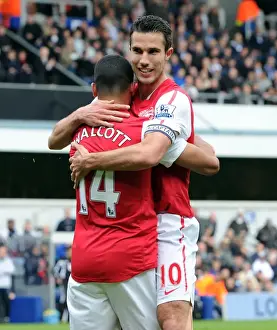 Theo Walcott celebrates scoring Arsenals goal with Robin van Persie. Queens Park Rangers 2