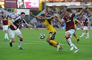 Burnley V Arsenal 2016-17 Prints: Theo Walcott Faces Off Against Burnley Defenders: A Intense Battle at Turf Moor