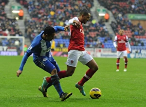 Wigan Athletic V Arsenal 2012-13 Prints: Theo Walcott Fouled by Jean Beausejour: Arsenal vs