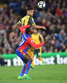 Crystal Palace V Arsenal 2016-17 Prints: Theo Walcott Leaps Above Jeffrey Schlupp in Crystal Palace vs Arsenal Premier League Clash