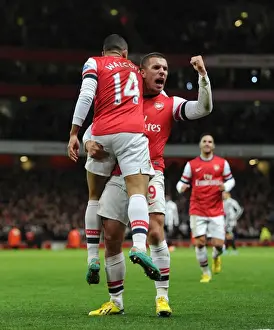 Theo Walcott and Lukas Podolski Celebrate Arsenal's First Goal vs. Newcastle United (2012-13)