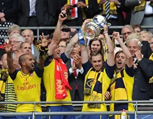 Theo Walcott, Olivier Giroud, Aaron Ramsey and Nacho Monreal (Arsenal) lift the FA