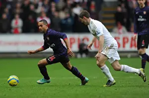 Swansea V Arsenal - FA Cup 3rd Rd 2012-13 Prints: Theo Walcott Outmaneuvers Ben Davies in FA Cup Clash: Swansea vs. Arsenal (2012-13)