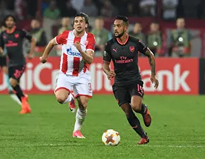 Red Star Belgrade V Arsenal 2017-18 Prints: Theo Walcott Outmaneuvers Filip Stojkovic in Arsenal's Europa League Clash vs Crvena Zvezda
