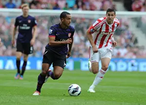 Stoke City V Arsenal 2012-13 Prints: Theo Walcott Outmaneuvers Geoff Cameron: A Pivotal Moment from Stoke City vs