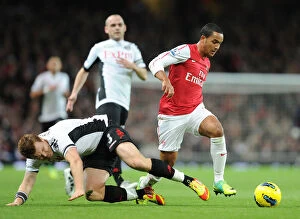 Images Dated 26th November 2011: Theo Walcott Outmaneuvers John Arne Riise: A Premier League Moment (Arsenal vs Fulham, 2011-12)