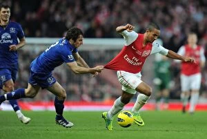 Images Dated 10th December 2011: Theo Walcott Outmaneuvers Leighton Baines: Arsenal vs. Everton, Premier League, 2011-12