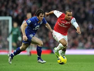 Images Dated 10th December 2011: Theo Walcott Outmaneuvers Leighton Baines in Arsenal vs. Everton Clash (2011-12)