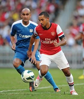 Images Dated 29th July 2012: Theo Walcott Outmaneuvers Zeshan Rehman: Kitchee FC vs. Arsenal FC, 2012