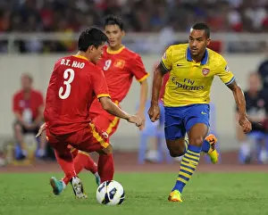 Vietnam V Arsenal 2013-14 Prints: Theo Walcott Outruns Duong Thanh Hao: Vietnam vs Arsenal Friendly, 2013