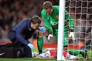 Arsenal V Manchester United 2011-12 Prints: Theo Walcott Receives Treatment from Colin Lewin as Anders Lindegaard Looks On: Arsenal v Manchester United