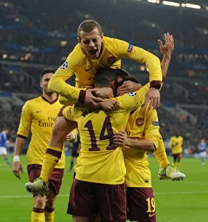 Schalke 04 v Arsenal 2012-13 Collection: Theo Walcott, Santi Cazorla, and Jack Wilshere: Celebrating Arsenal's First Goal Against Schalke