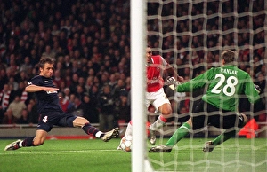 Images Dated 24th October 2007: Theo Walcott scores his 2nd goal, Arsenals 5th, past Martin Vaniak (Slavia)